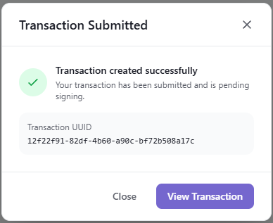 Transaction Submitted modal showing the new transaction UUID